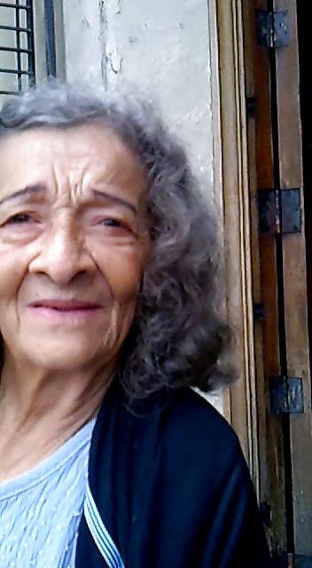 13P Grandmother begging at the entrance of the church