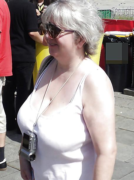 24P Busty mature women dressed.