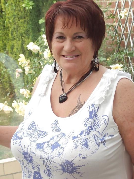24P Busty mature women dressed.