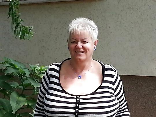24P Busty mature women dressed.