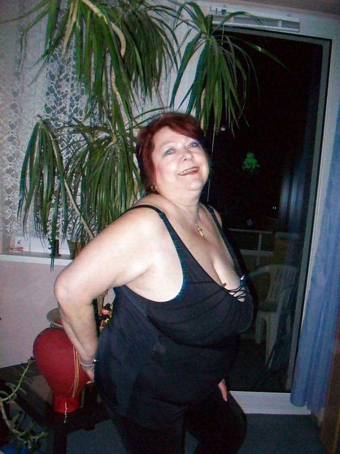 24P Busty mature women dressed.