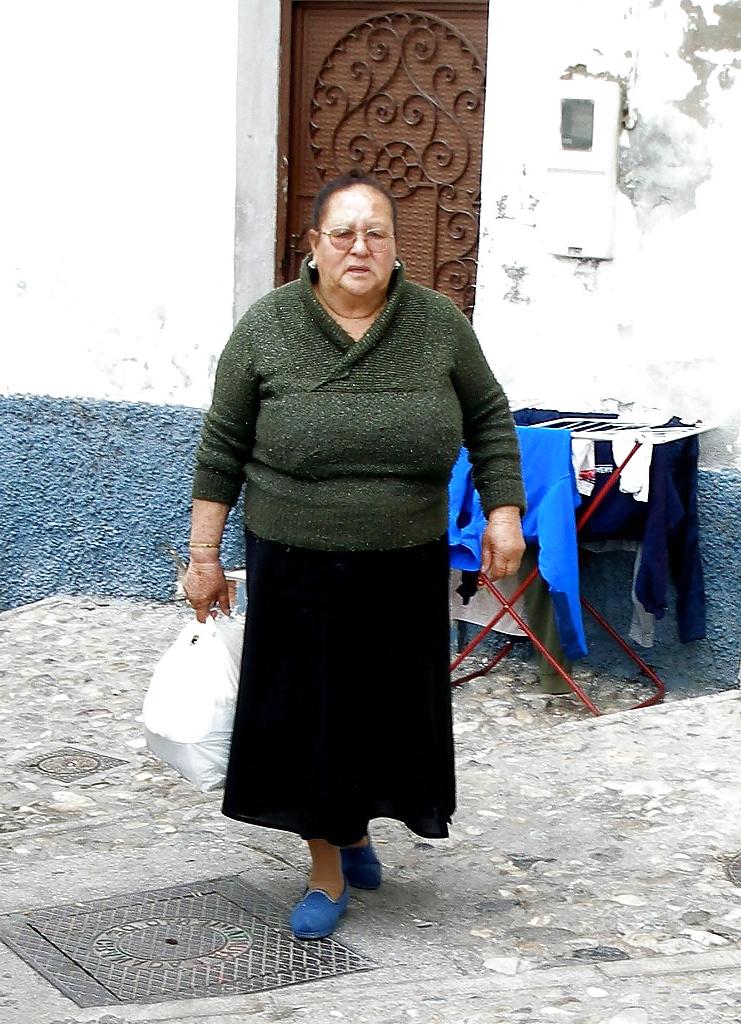 24P Busty mature women dressed.