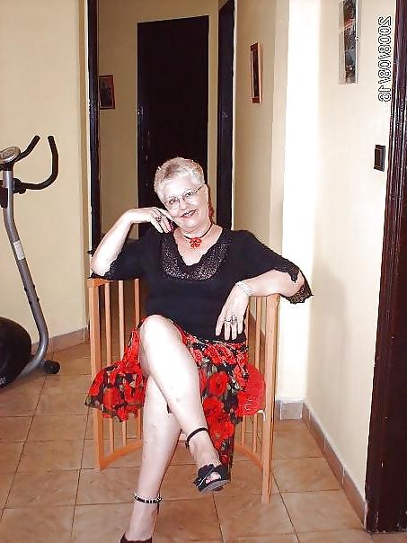 24P Busty mature women dressed.