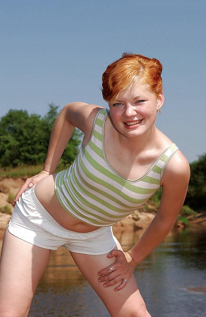 17P Stunning redhead getting fucked by a lake