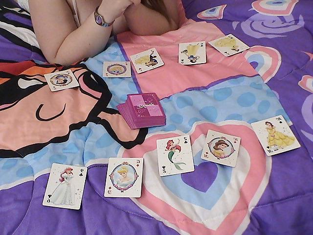 15P Chubby brunette playing cards on her bed
