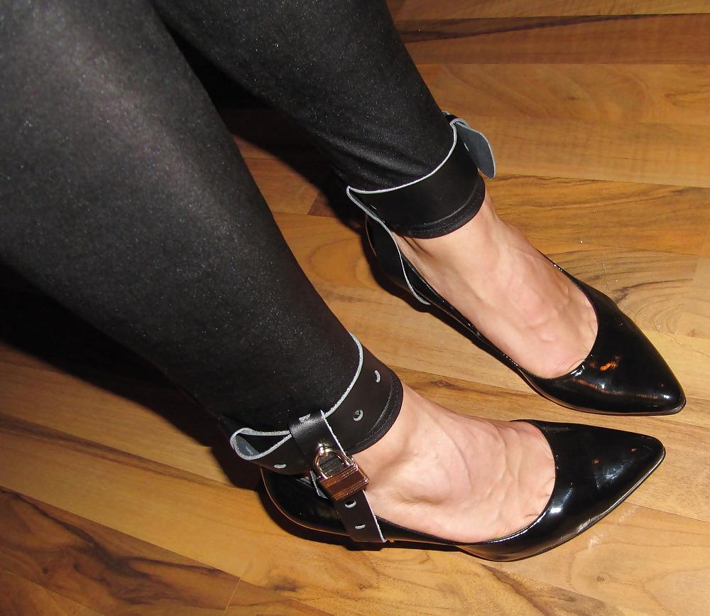 22P Foot torture with peas in high heels, leggings and corset