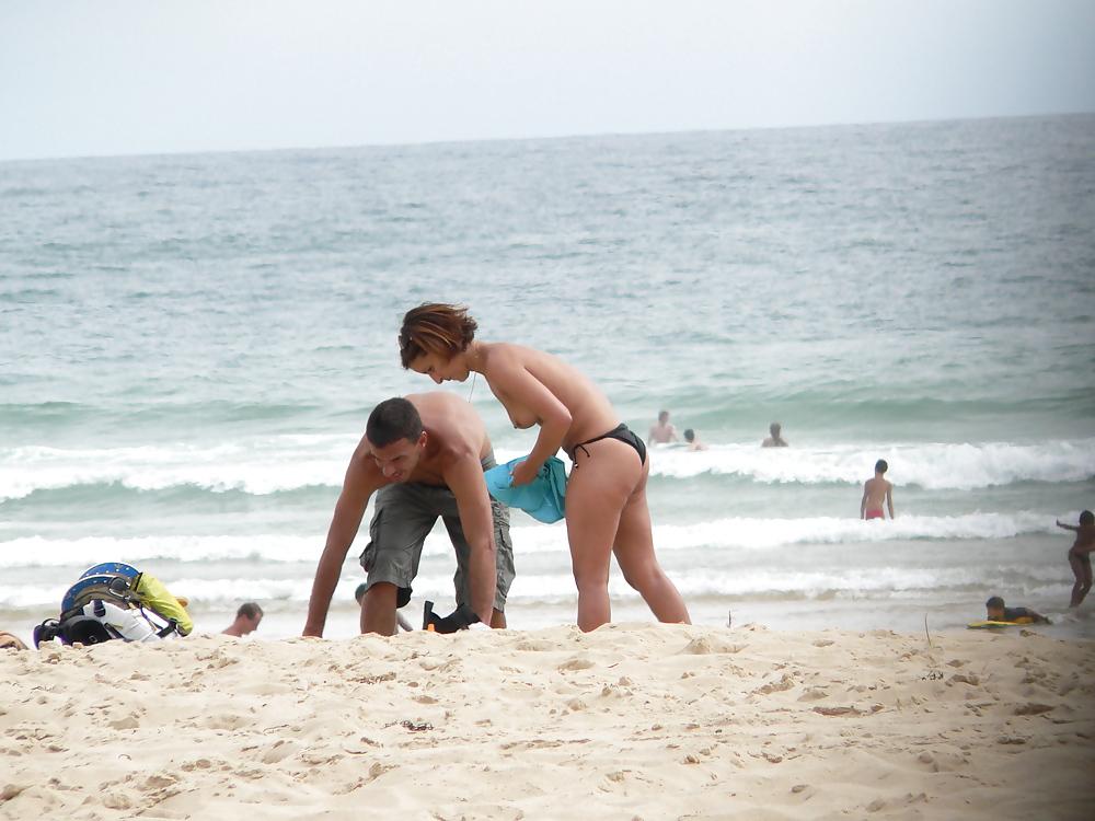 6P Topless beach brunette