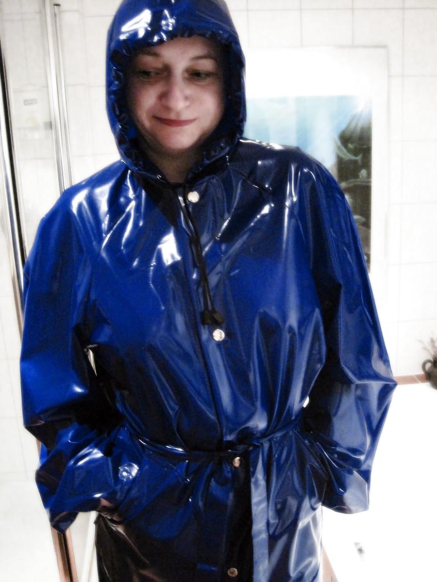 13P MILF wearing a blue PVC Raincoat
