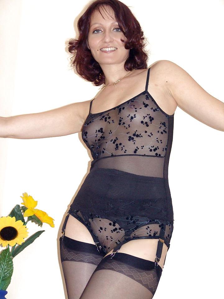 15P Kirsty Blue posing in black stockings