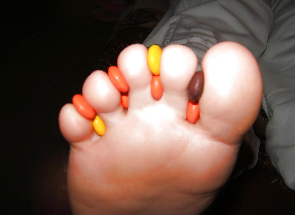 25P Girls feet covered in food