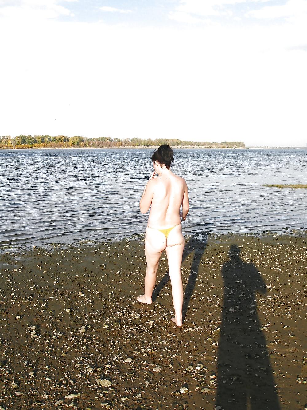 16P Lili on the beach topless in yellow panties