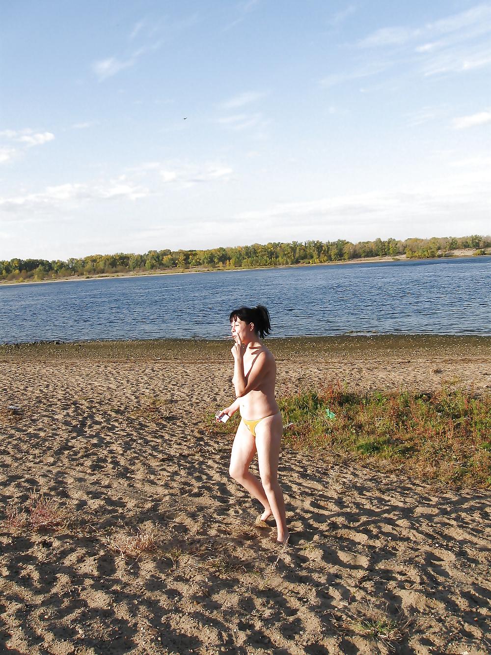 16P Lili on the beach topless in yellow panties