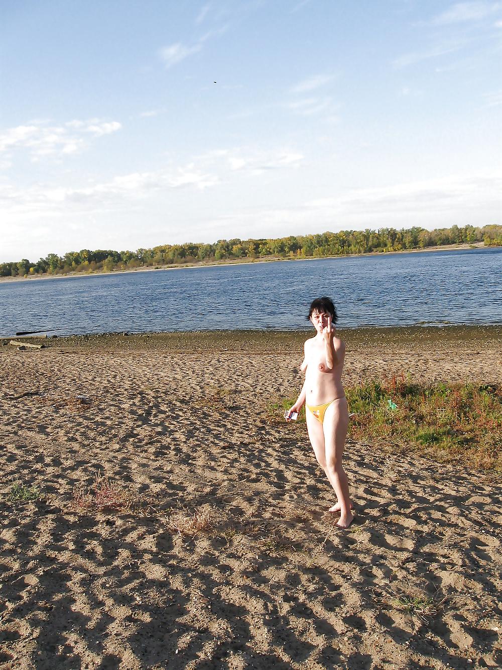 16P Lili on the beach topless in yellow panties
