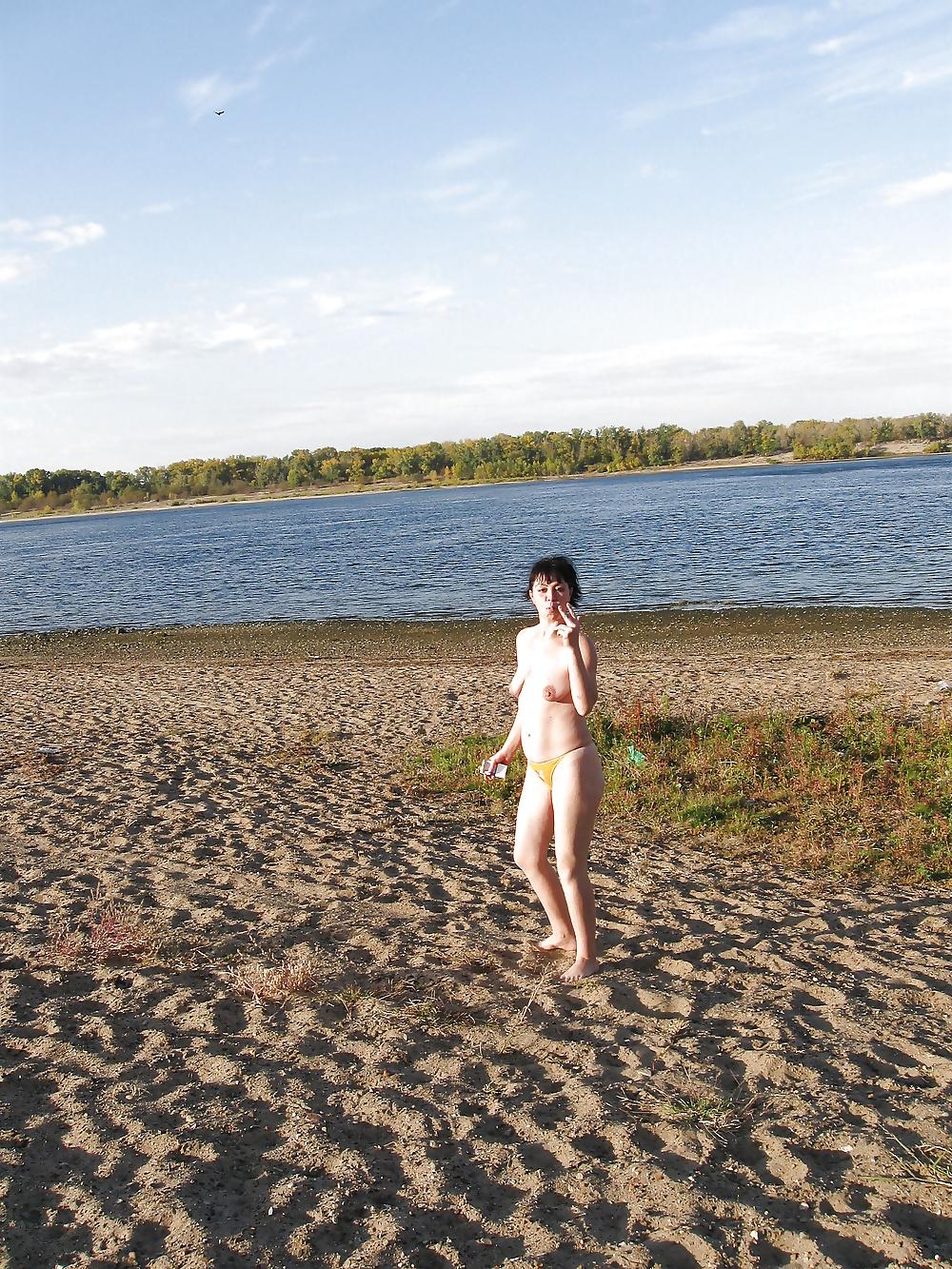 16P Lili on the beach topless in yellow panties