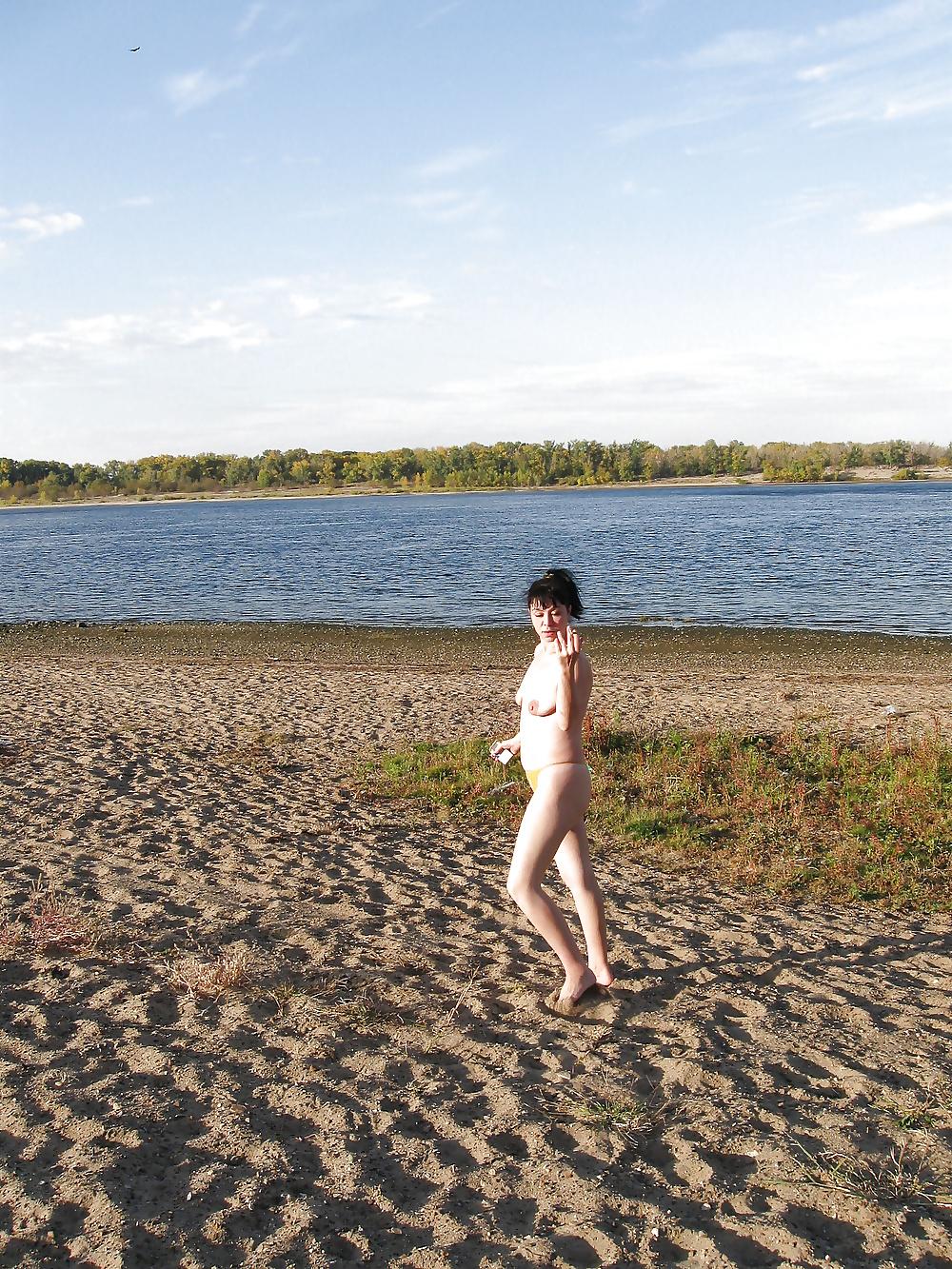 16P Lili on the beach topless in yellow panties