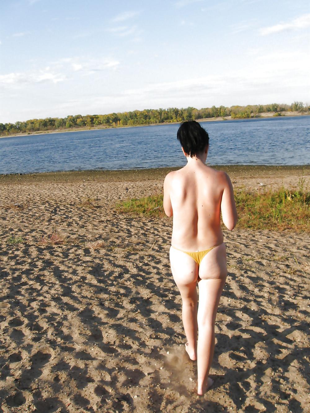 16P Lili on the beach topless in yellow panties