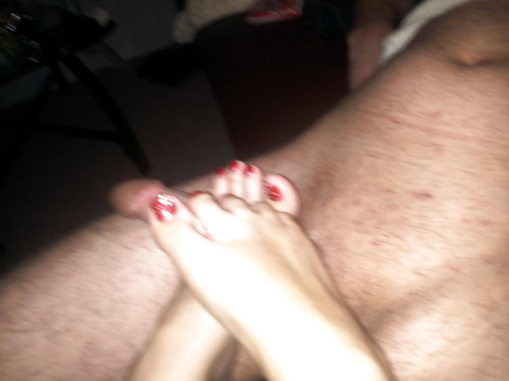 25P Wife doing a footjob on husband