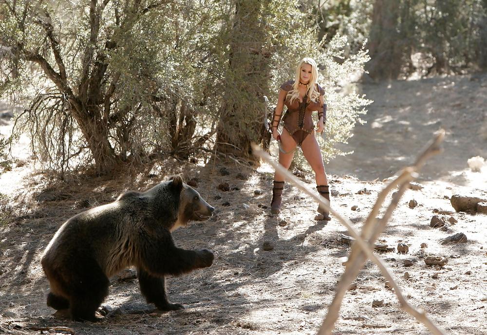 25P Busty hunter Shyla getting naked next to a Russian bear