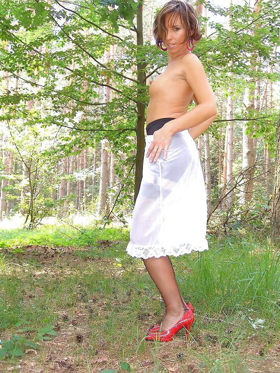 20P Kelly Dee in blue skirt black stockings and heels outdoors