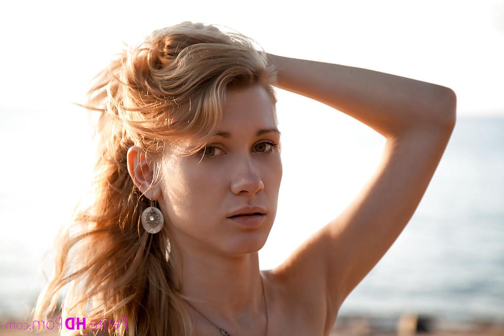 12P Elegant slim babe Mariana walks on the beach and does nude shoots