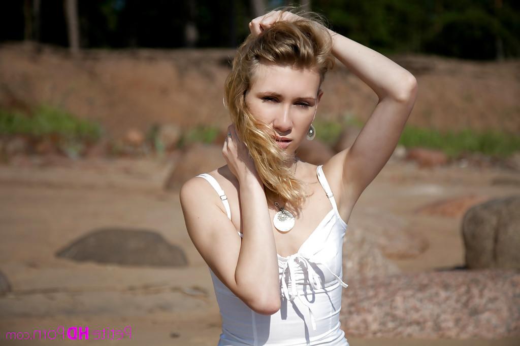 12P Elegant slim babe Mariana walks on the beach and does nude shoots
