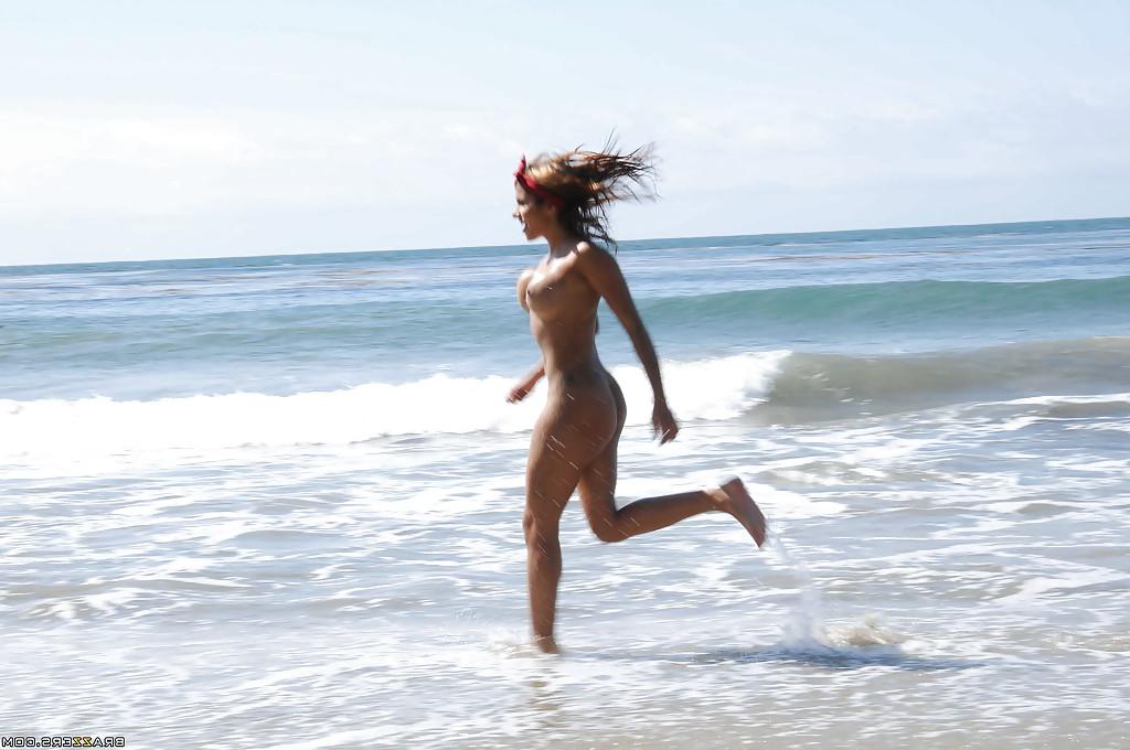 16P Frisky latina Anita Toro exposing her gorgeous oiled up body on the beach