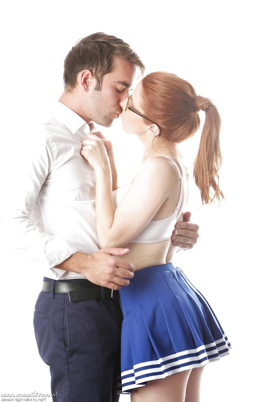 15P Cute redhead cheerleader Penny Pax in glasses baring big tits & firm ass