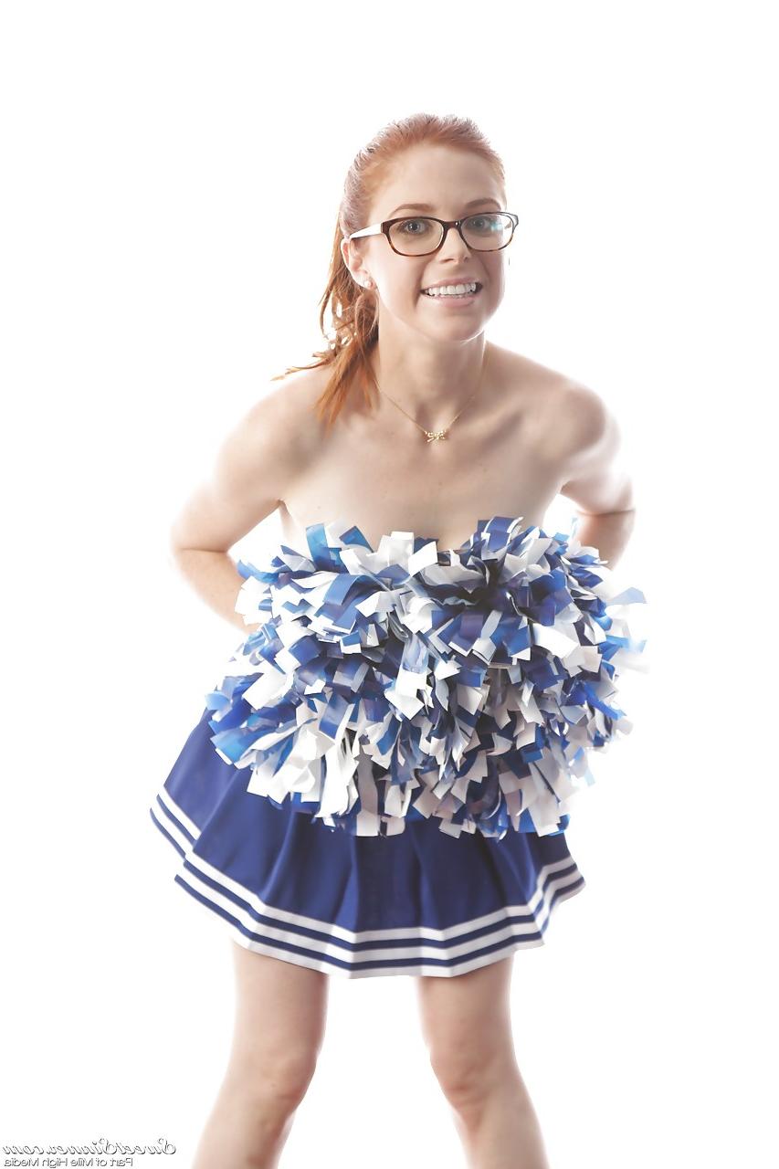 15P Cute redhead cheerleader Penny Pax in glasses baring big tits & firm ass