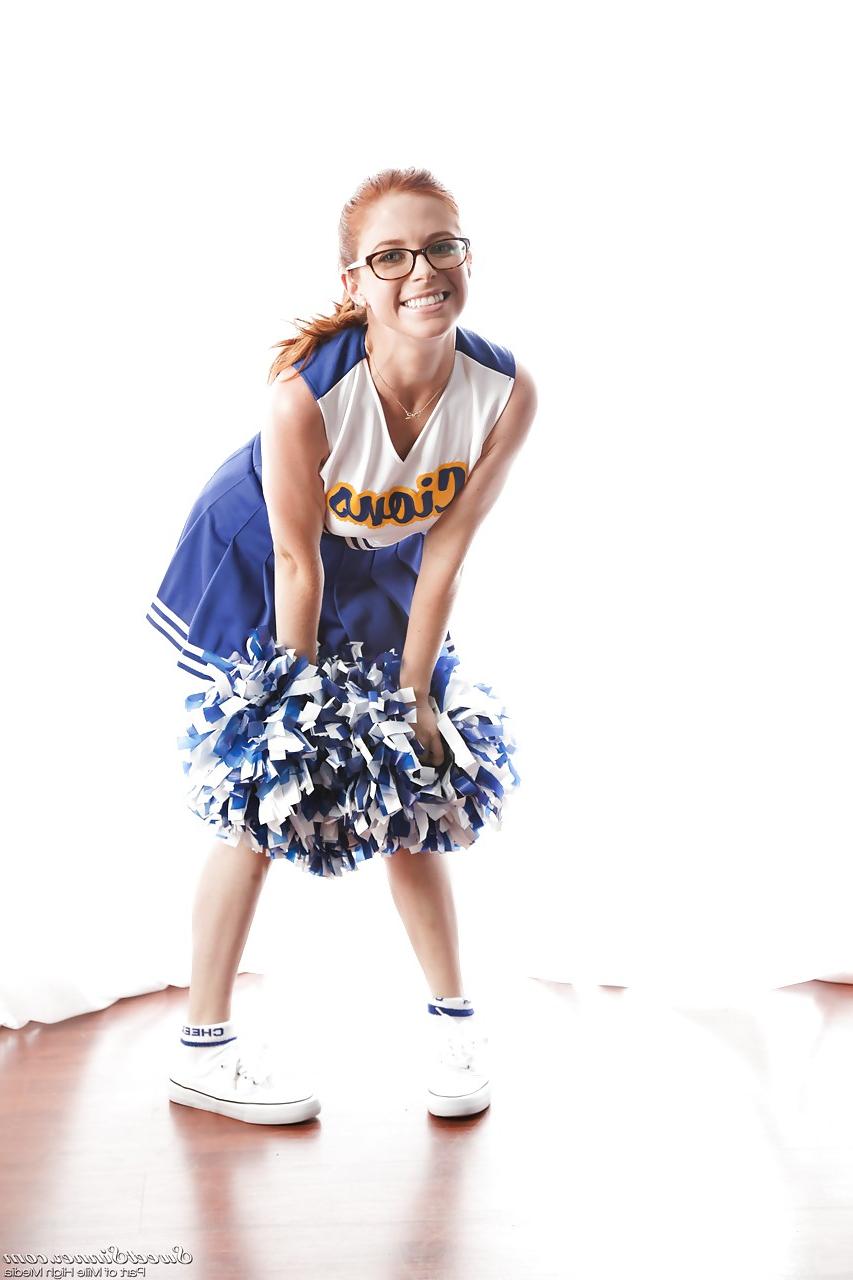 15P Cute redhead cheerleader Penny Pax in glasses baring big tits & firm ass