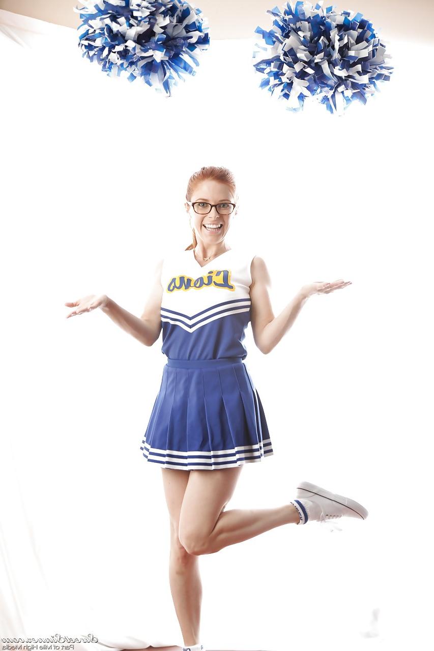 15P Cute redhead cheerleader Penny Pax in glasses baring big tits & firm ass