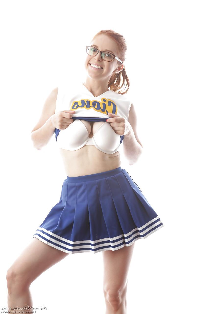15P Cute redhead cheerleader Penny Pax in glasses baring big tits & firm ass