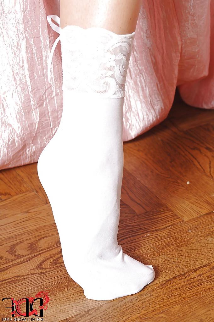 16P Desirable girl in lingerie and white socks revealing her curves and sexy feet