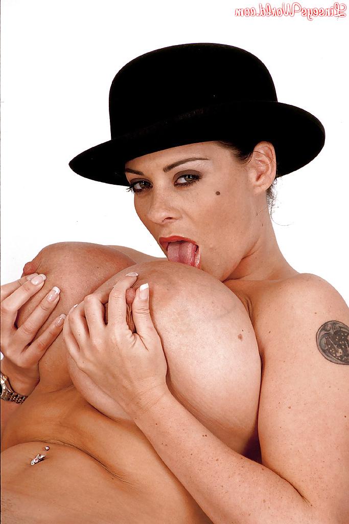 16P MILF solo girl Linsey Dawn McKenzie posing in hat while exposing huge juggs