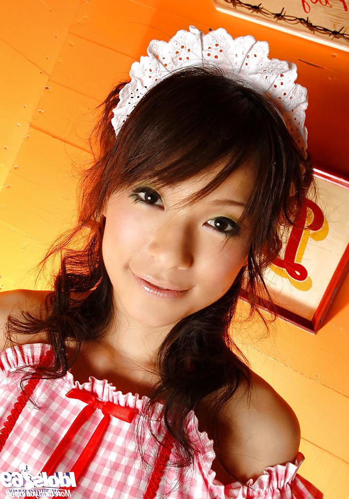 15P Cuddly asian teen Kaho Kasumi slowly uncovering her tempting curves