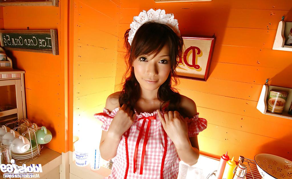 15P Cuddly asian teen Kaho Kasumi slowly uncovering her tempting curves