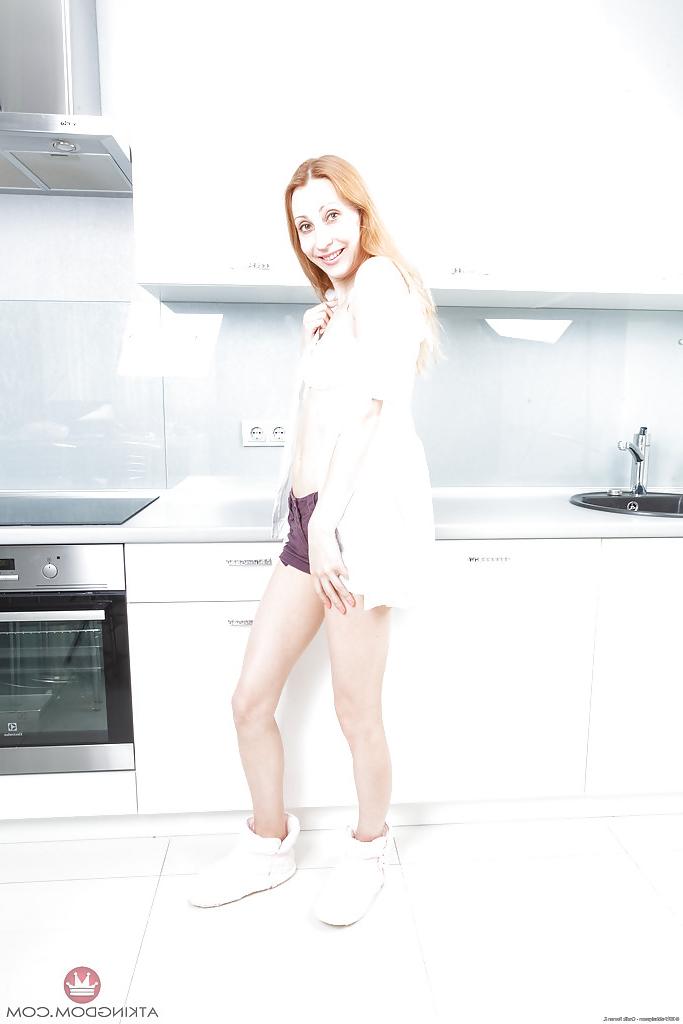 16P Older redhead model Kler undressing to reveal her hairy pussy