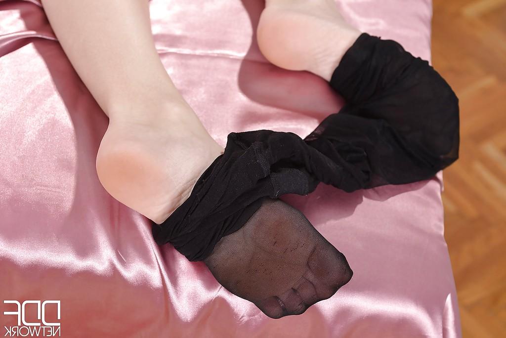 16P Brookie G. is teasing her hot legs in her sweet black pantyhose