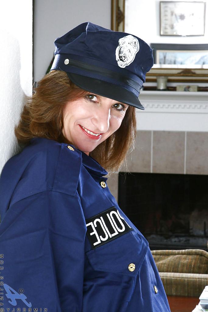 16P Luscious mature in lady cop uniform brings out nice boobies and tight ass