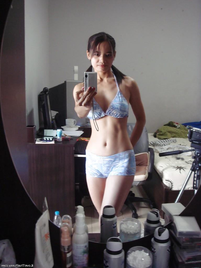 16P Playful Asian babe Lana Selfshot demonstrating trimmed pussy and fingering