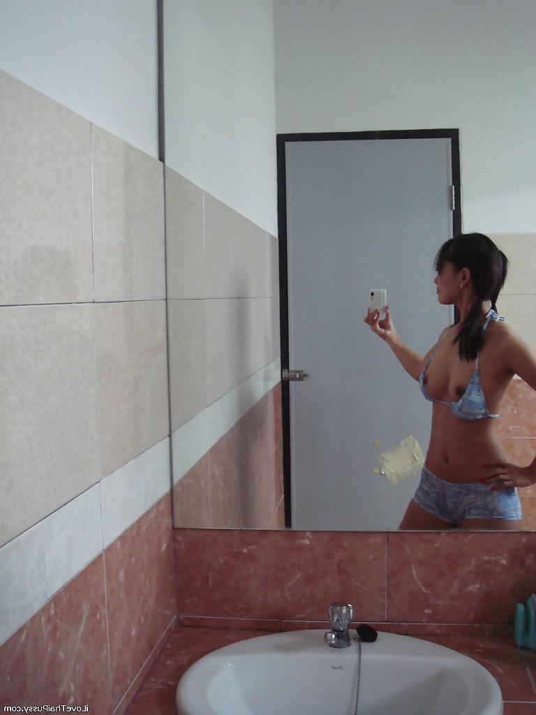 16P Playful Asian babe Lana Selfshot demonstrating trimmed pussy and fingering