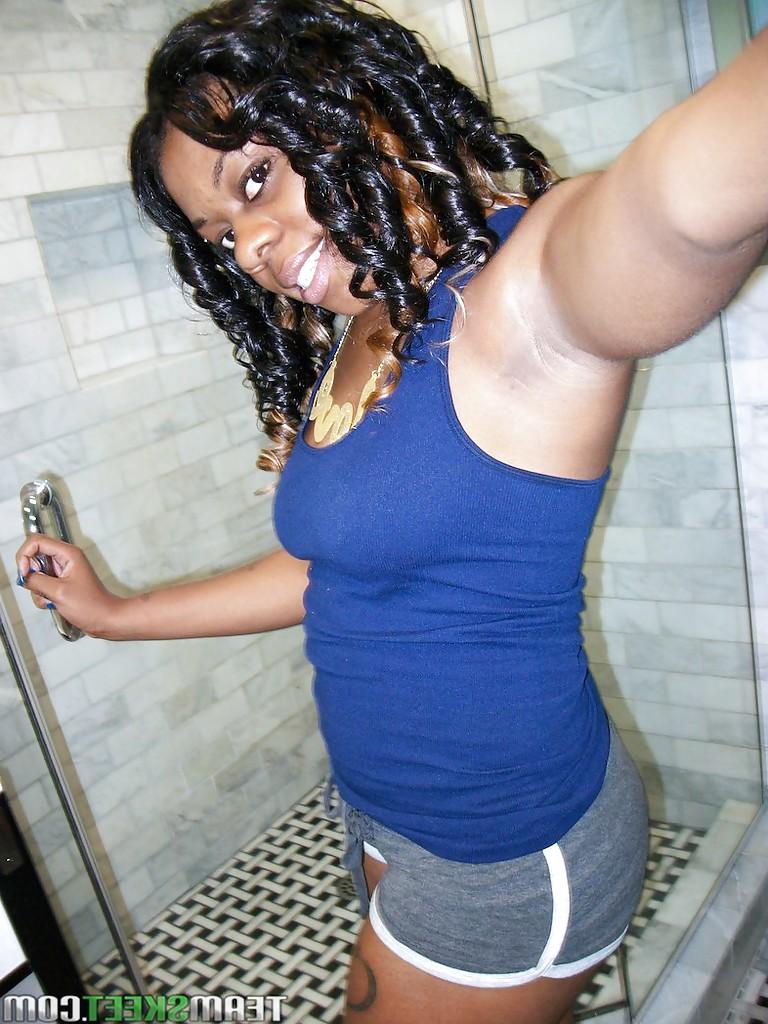 16P Appealing ebony babe Blue Love sticks her tongue out and masturbates