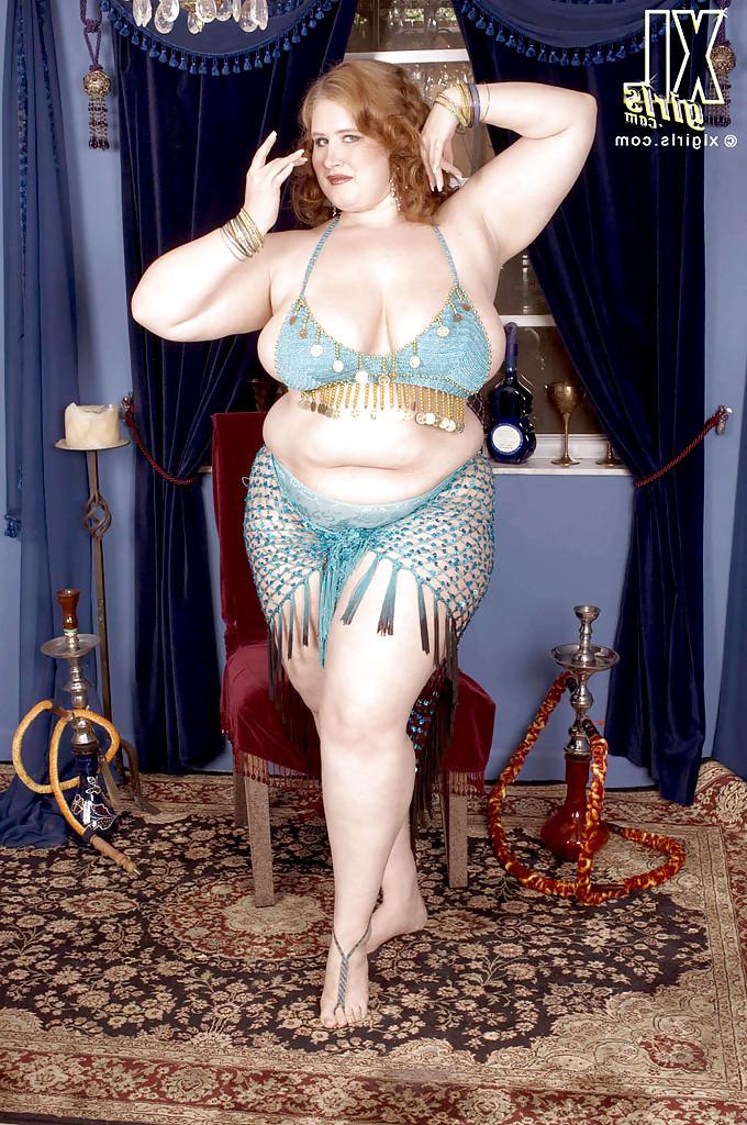 16P Miss Isabelle performs a belly dance and makes her fat tits and ass bounce
