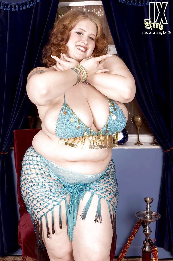 16P Miss Isabelle performs a belly dance and makes her fat tits and ass bounce