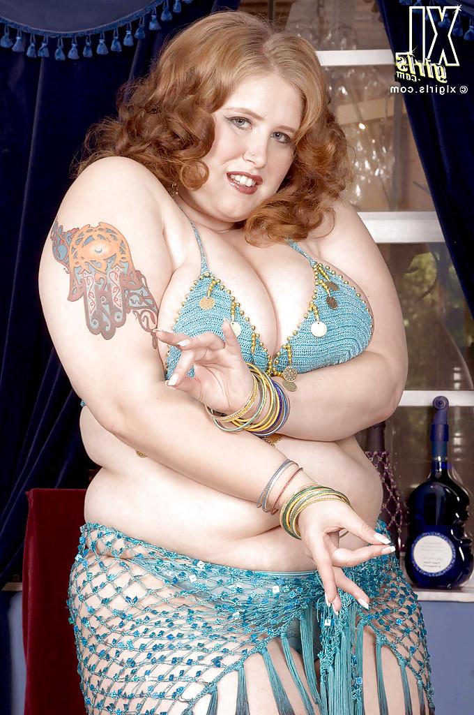 16P Miss Isabelle performs a belly dance and makes her fat tits and ass bounce