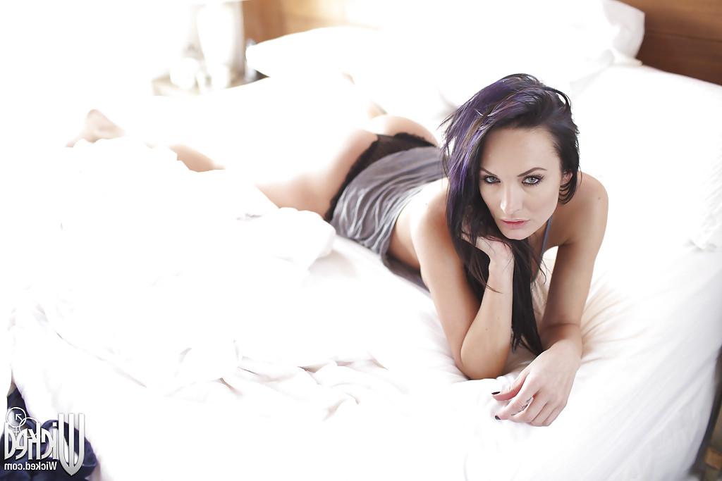 16P Tempting babe Alektra Blue showcasing her seductive curves on the bed