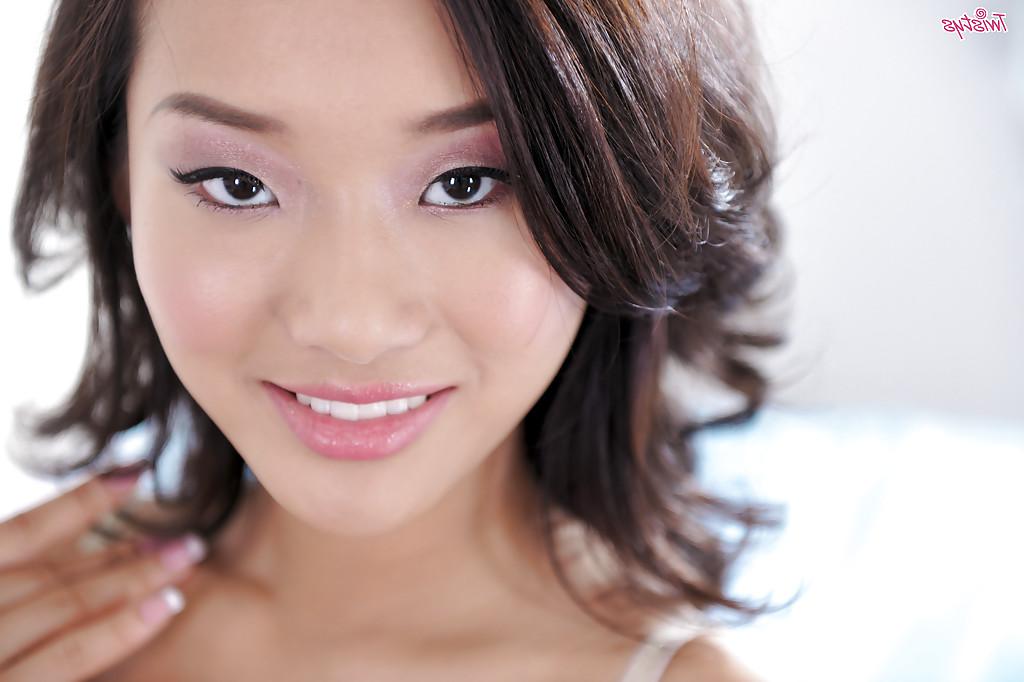 16P Asian pornstar Alina Li is teasing her shaved pussy while on her knees
