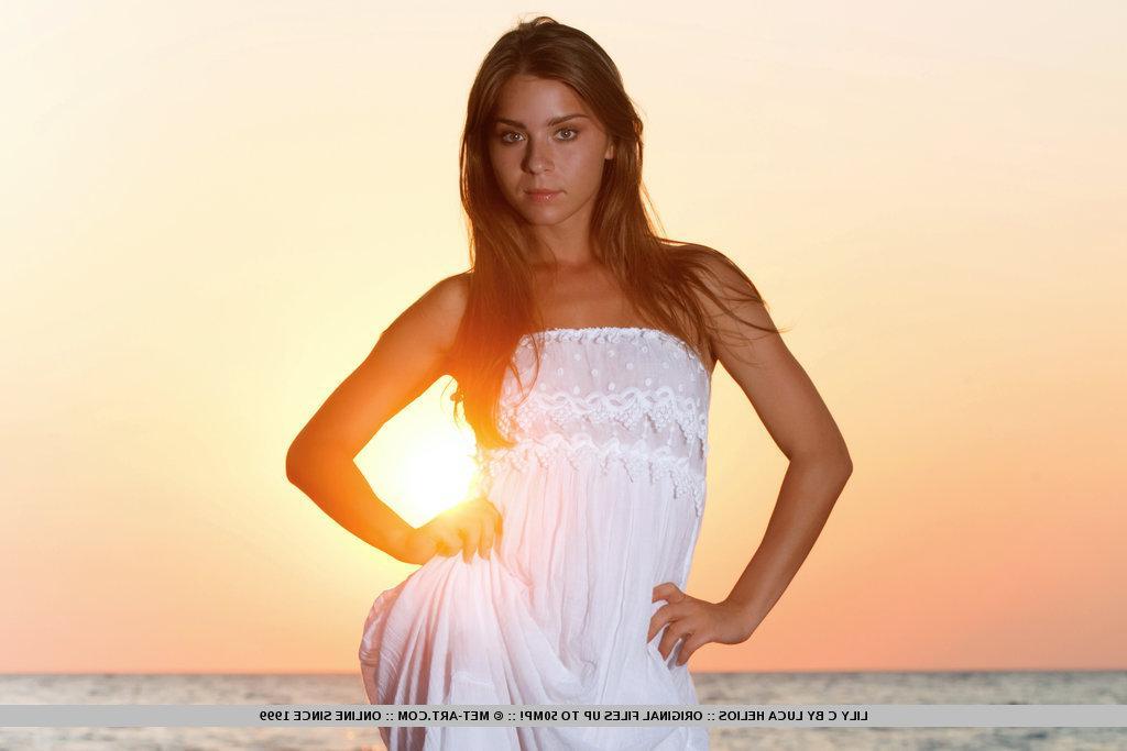 18P Pictures of teen beauty Lily C showing her hot nude body on a beach