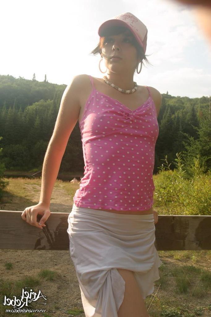 15P Pictures of teen girl Ariel Rebel showing you up her skirt outside