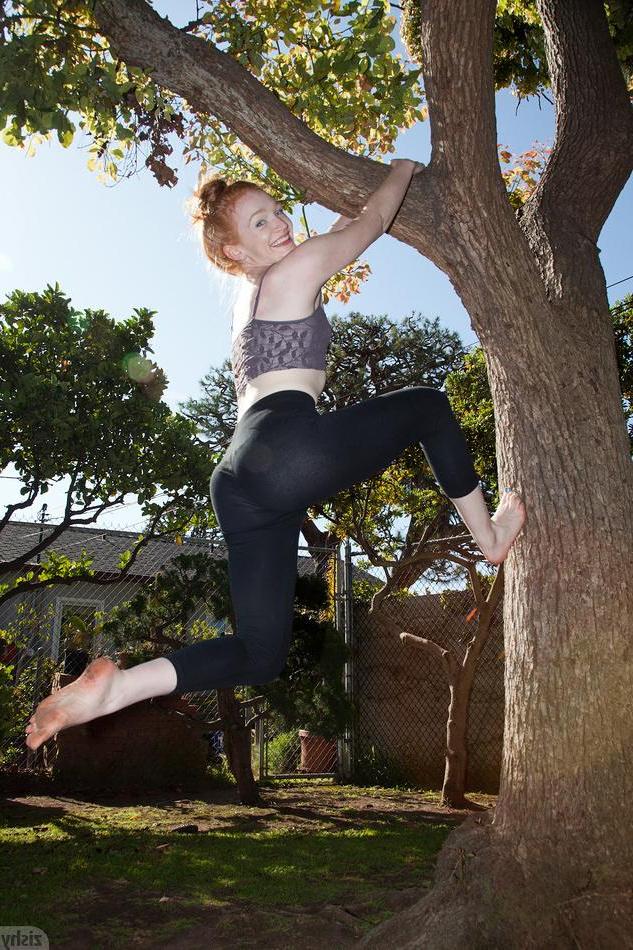 12P Redhead girl Bree Abernathy displays how flexible she is outside