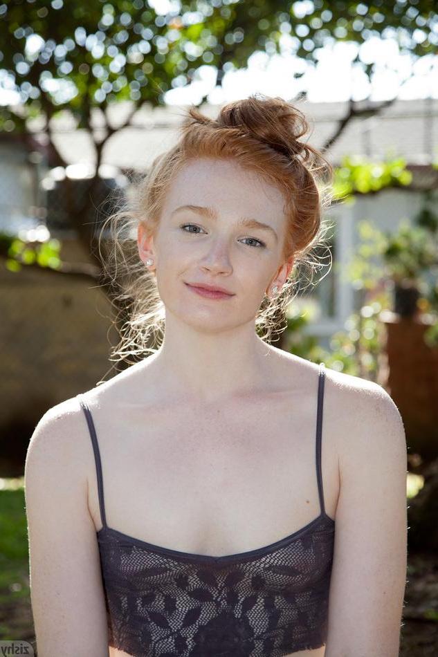 12P Redhead girl Bree Abernathy displays how flexible she is outside